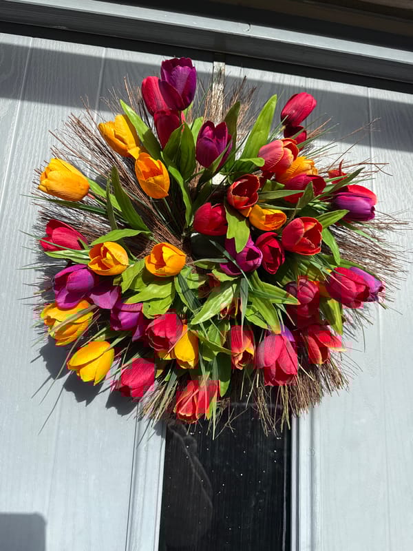 Spring tulip wreath adorns residential door in Great Yarmouth