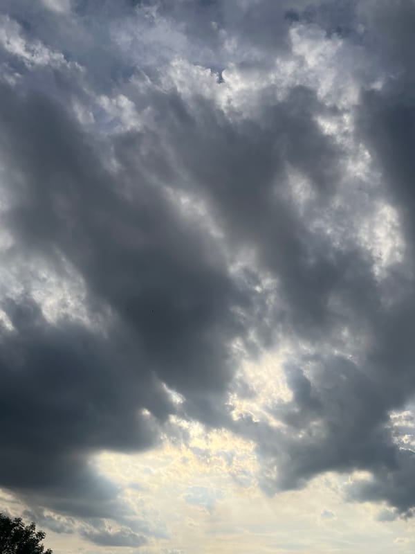Urban sky-watching session documents changing clouds over city landscape