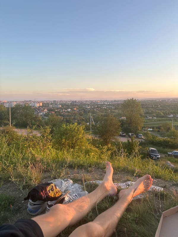 Hilltop pizza picnic with panoramic sunset city views