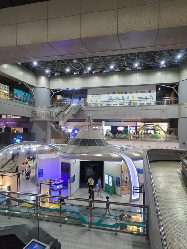 Visitor documents science museum exhibits in Daejeon, South Korea