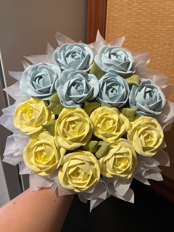 Pastel confectionery roses arranged and filmed from above