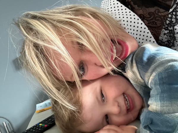 Mother and child share tender moment in Belgian town