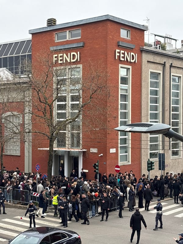 Crowd gathers outside Fendi headquarters in Milan