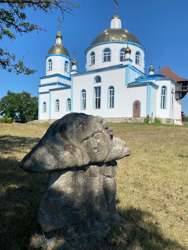Historic cemetery and stone sculptures in Busha, Ukraine