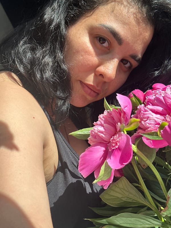Woman and child photographed with pink peonies in brief session
