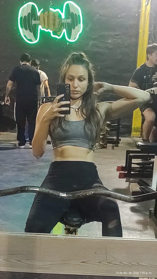 Woman takes gym mirror selfie in Wilde, Argentina