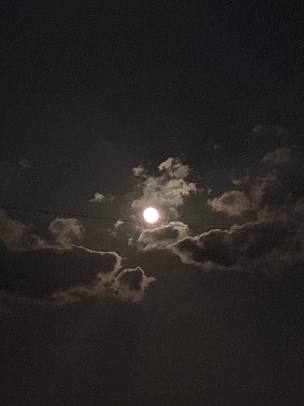 Full moon observed through clouds in Hrodna, Belarus