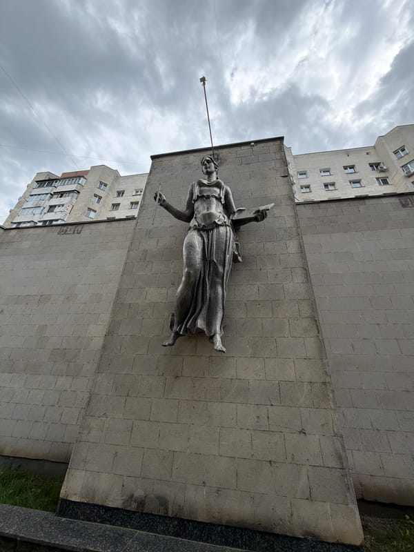 Woman statue with book documented in Chișinău, Moldova
