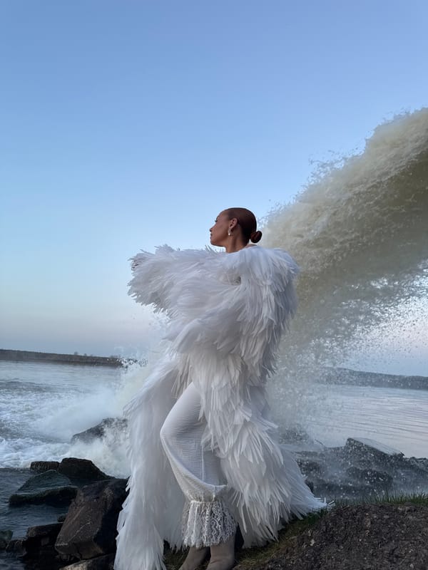Woman in white dress photographed at Chernushka waterfall