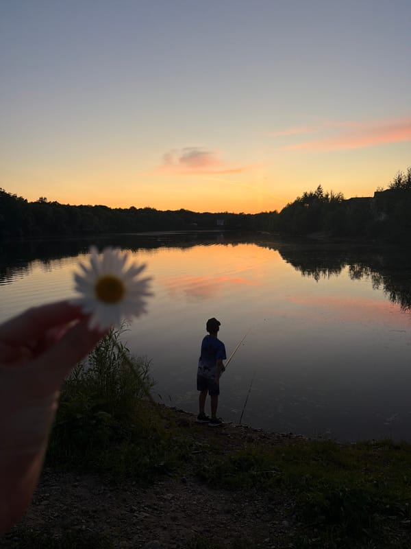 Fishing at dusk on a calm lake near Birobidzhan