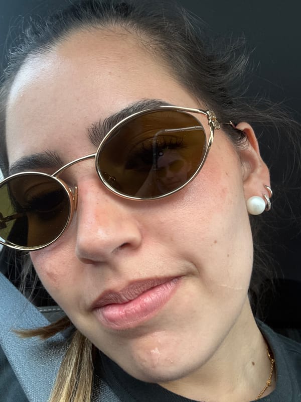 Person in gold sunglasses photographed in Live Oak