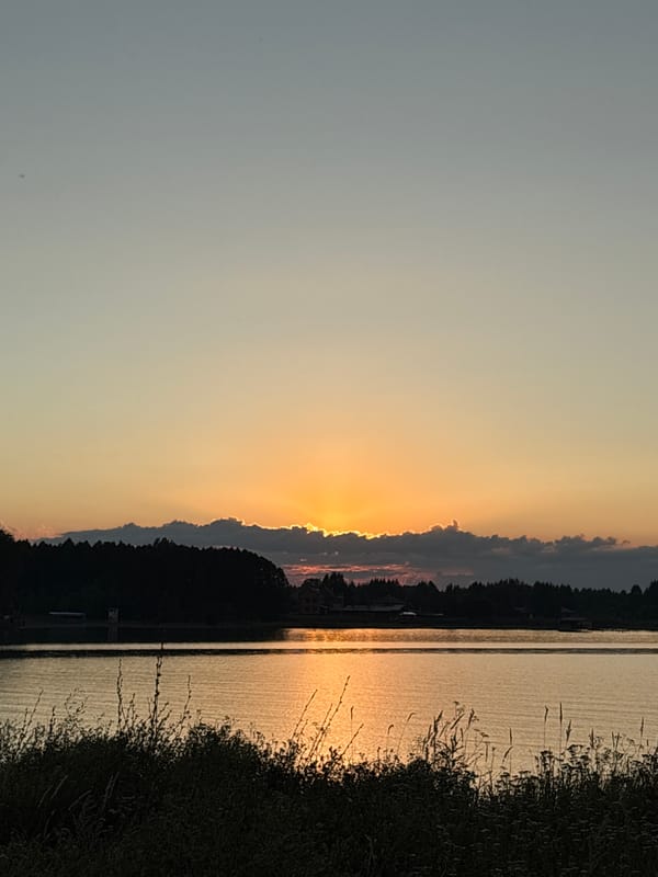 Warm sunset over a river or lake near Elovo, Russia
