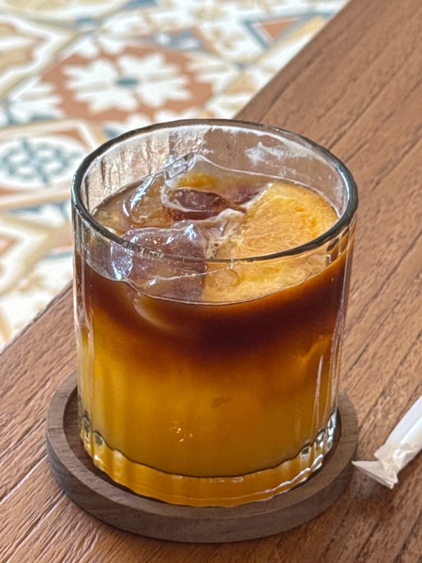 Late night iced coffee moment captured in Ungasan, Indonesia