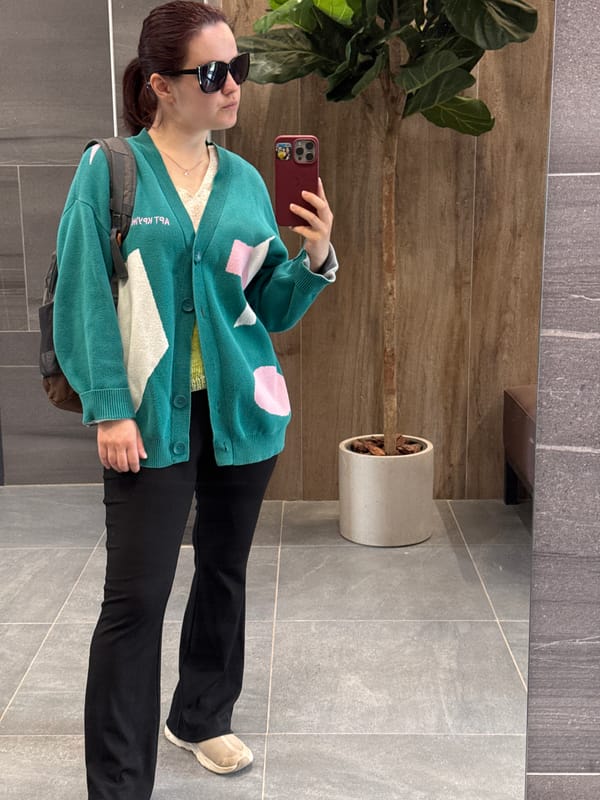 Woman takes mirror selfie in Izhevsk building lobby