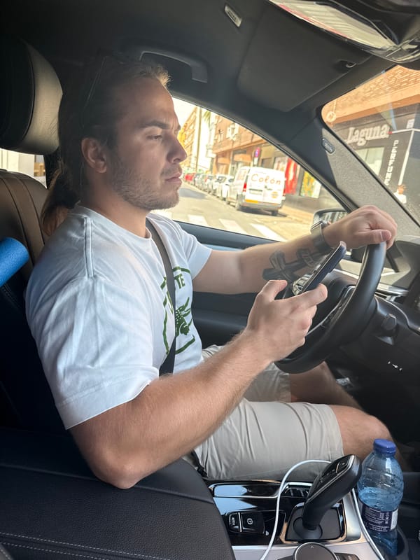 Man driving car observed in Valencia during sunny afternoon