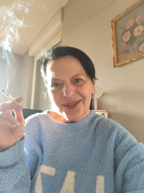 Woman smoking cigarette in Ostwald, France