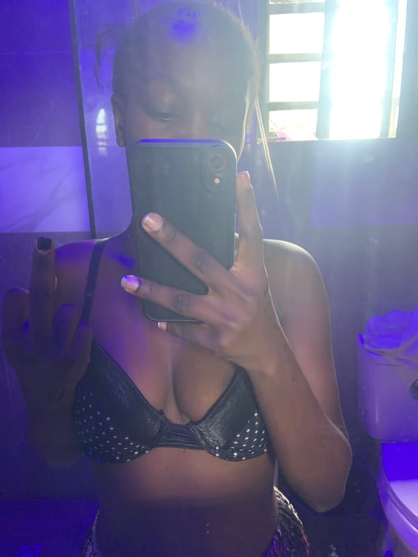 Person takes multiple mirror selfies in Ota, Nigeria home