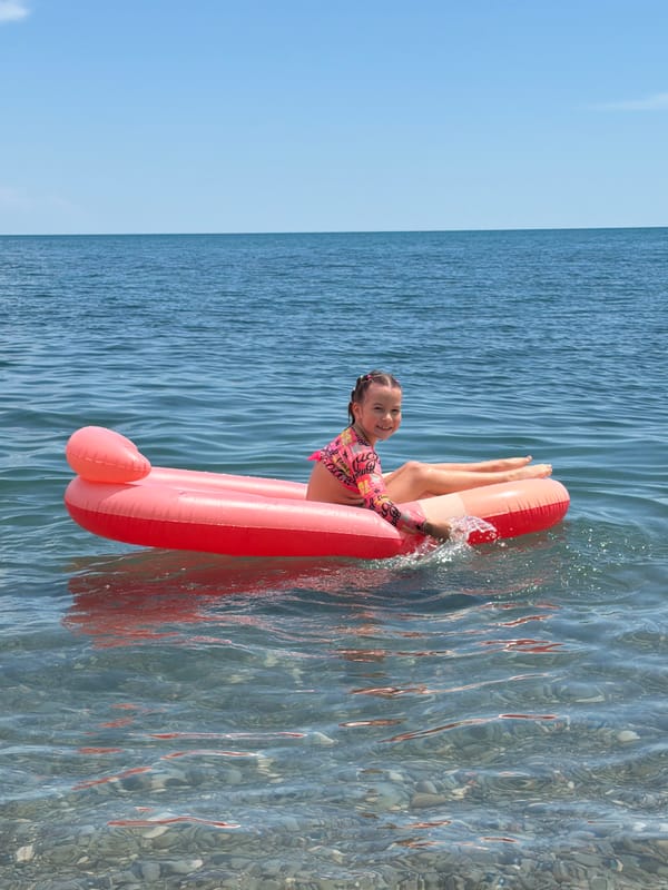 Families enjoy summer morning at Partenit beach, Ukraine
