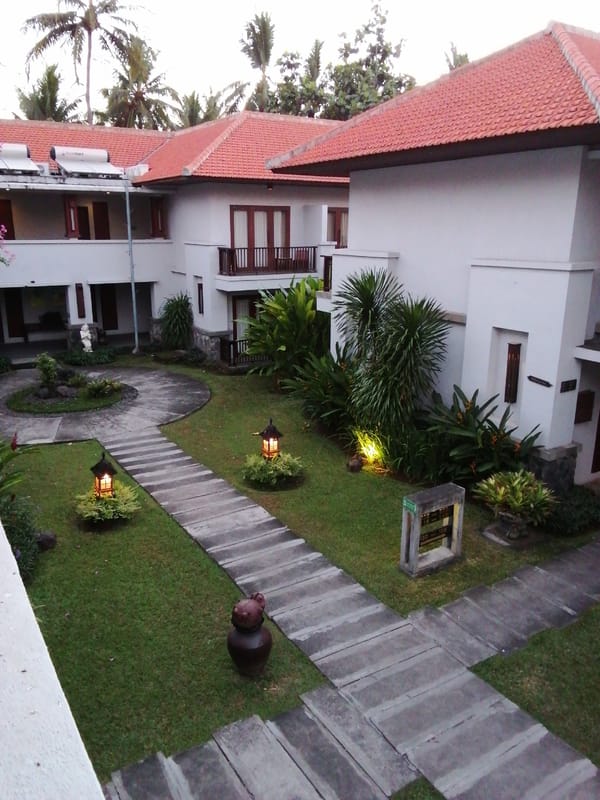 Resort courtyard in Bulusan at dusk, inside and out