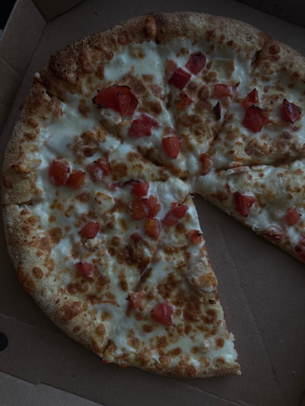 Cat naps and pizza slice captured in Zheleznogorsk home