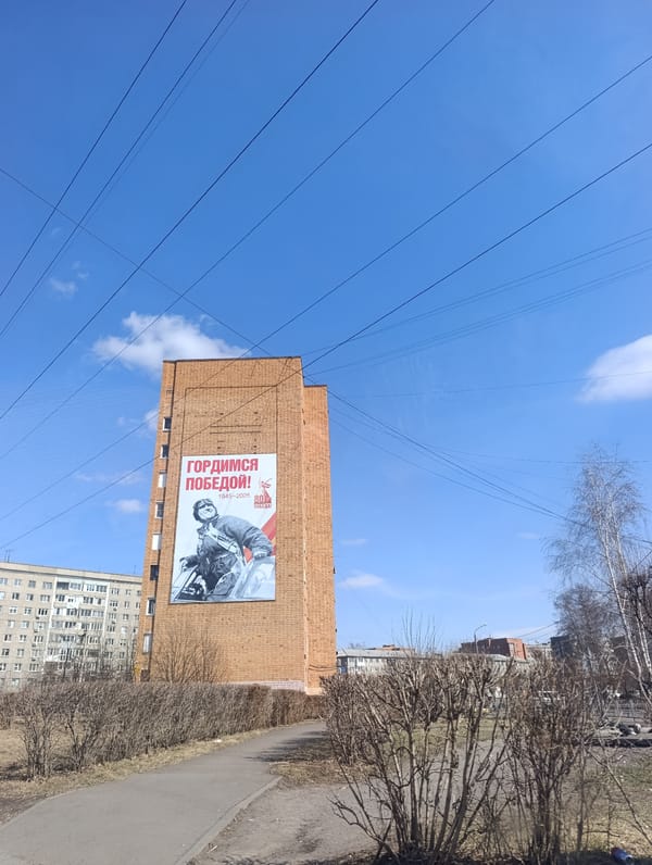 Clear morning documented in Krasnoyarsk featuring brick building mural