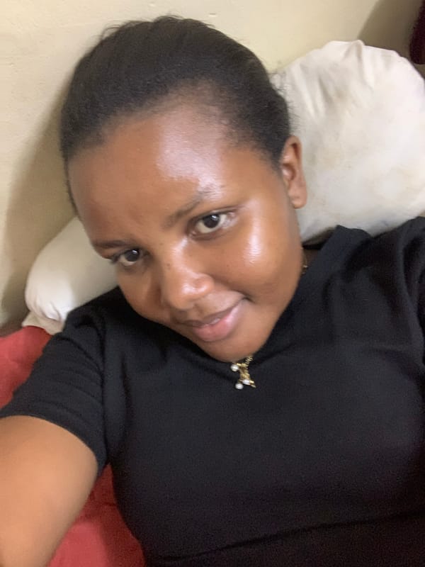 Person resting on pillow captured in Dar es-Salaam