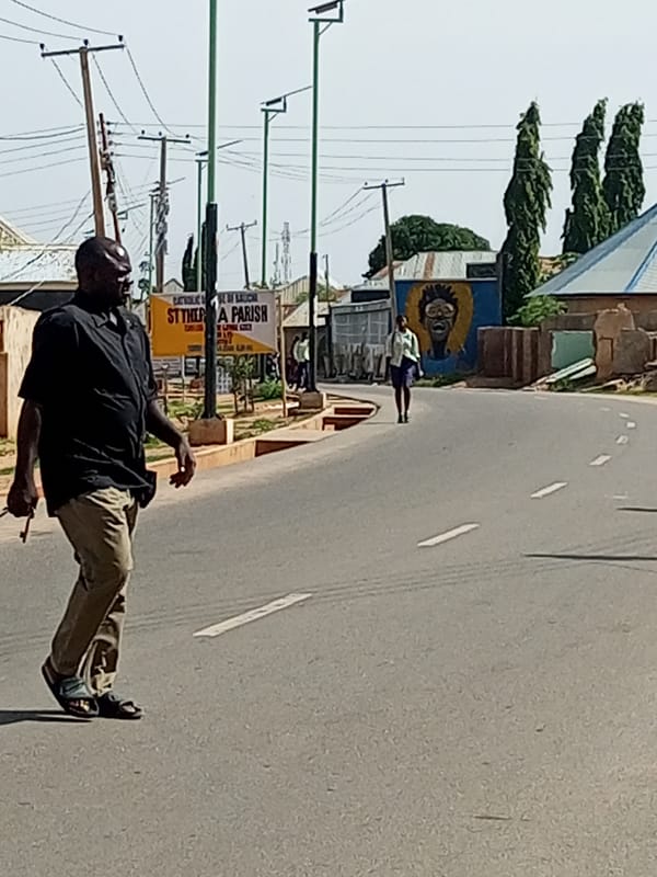 Morning street life and motorcycle traffic in Gombe, Nigeria