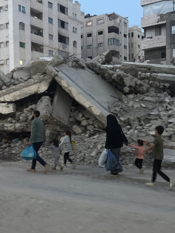 Gaza residents conduct daily commerce amid damaged cityscape