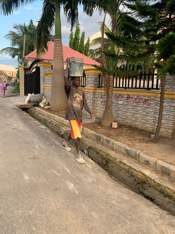 Afternoon street life captured across Abuja residential neighborhoods