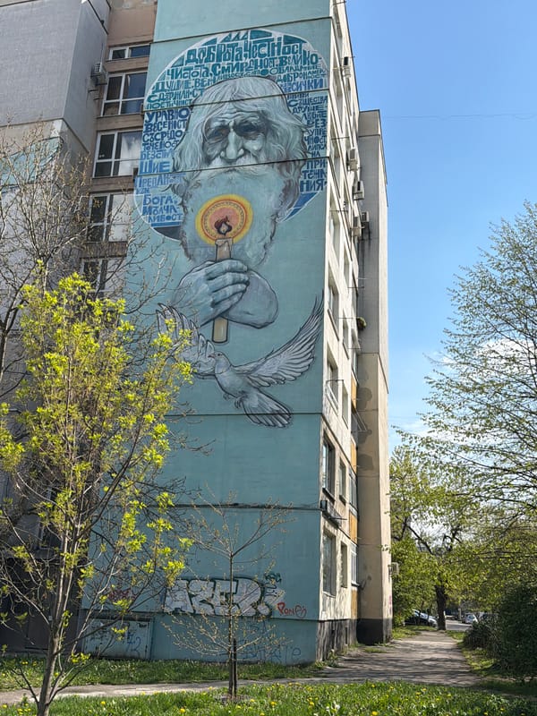 Vibrant mural featuring bearded elder spotted on Sofia building