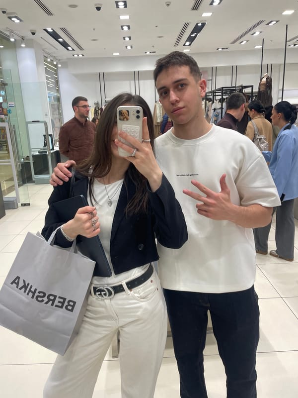 Couple shops and takes selfies at Yerevan clothing store