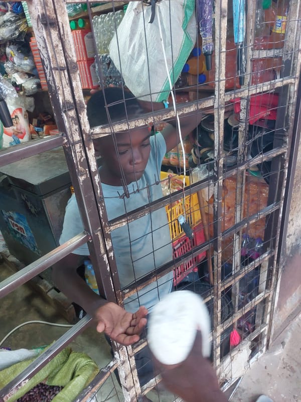 Daily life documented across muddy Dar es-Salaam neighborhoods