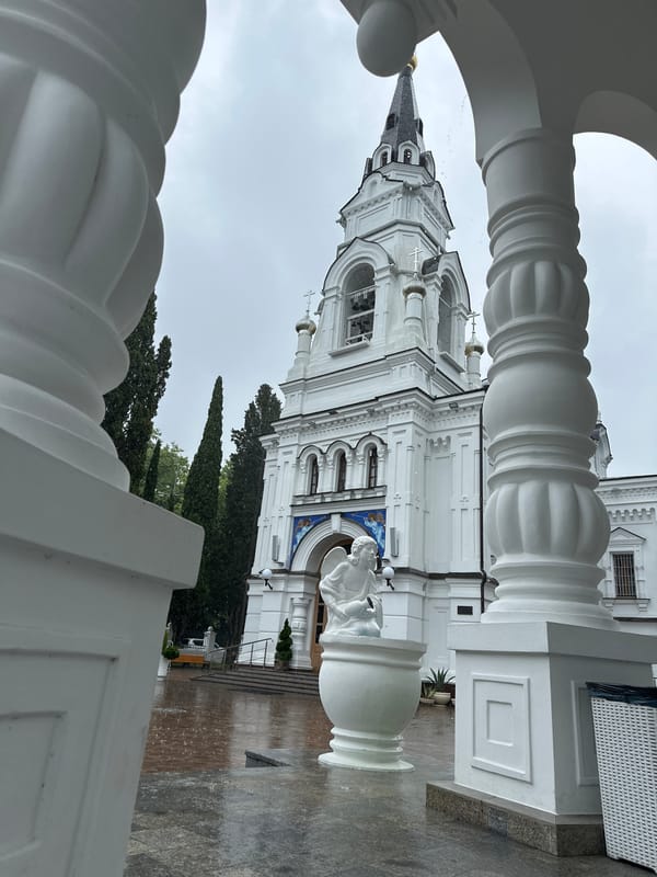 Rainy day at a white Orthodox church complex in Sochi