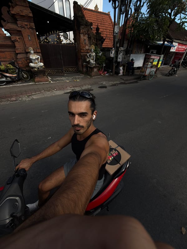 Scooter rider captures selfies during morning ride in North Kuta