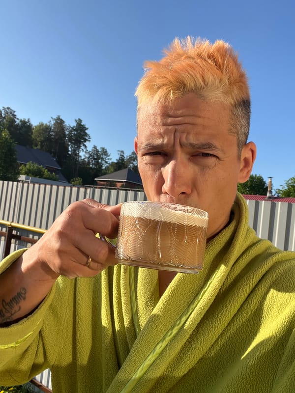 Man enjoys morning beverage outdoors in Chaikovsky, Russia