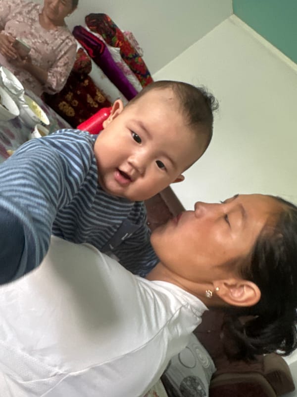Home gathering in Kyrgyzstan with a baby, gifts, and car work