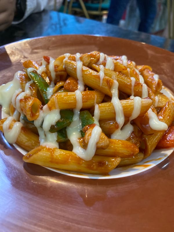 Family dining scene captured at Dhaka restaurant serving pasta