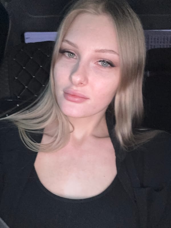 Woman photographed in car during brief sequence in Perm