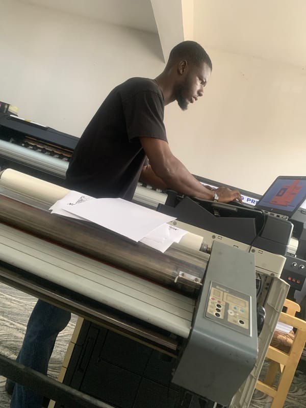 Working a large format printer in a small print shop