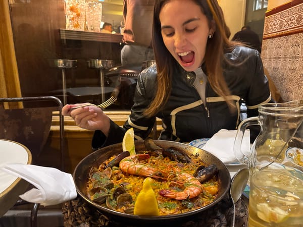 Woman enjoys Spanish tapas dinner at Paris restaurant
