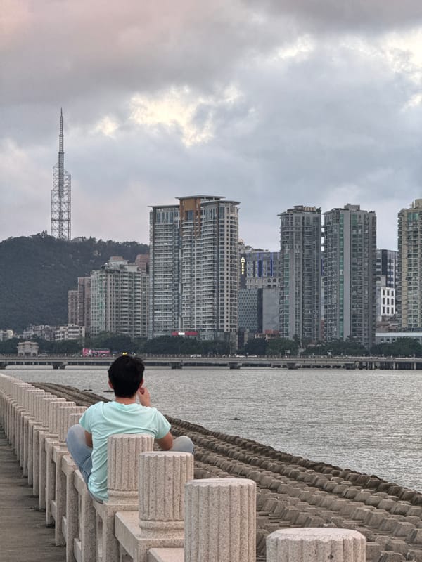 Morning scenes along Xiangzhou waterfront show people with phones