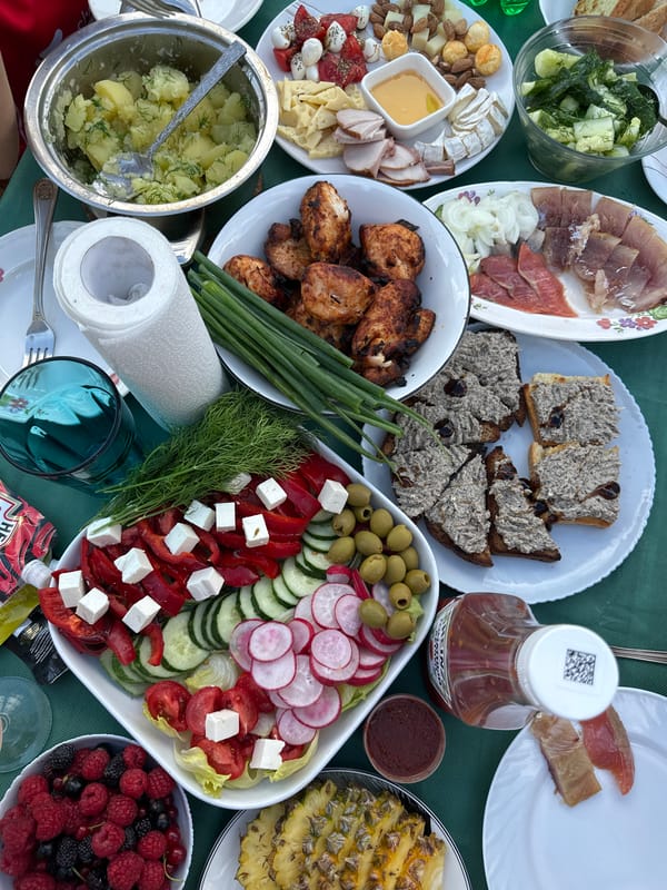 Outdoor gathering with a full spread in Chaikovsky, Russia