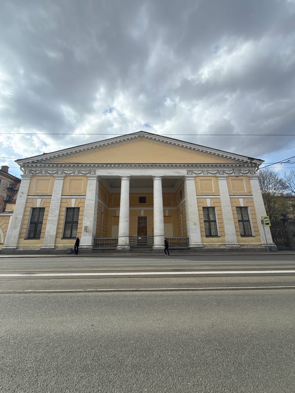 Classical yellow building with portico documented in Saint Petersburg