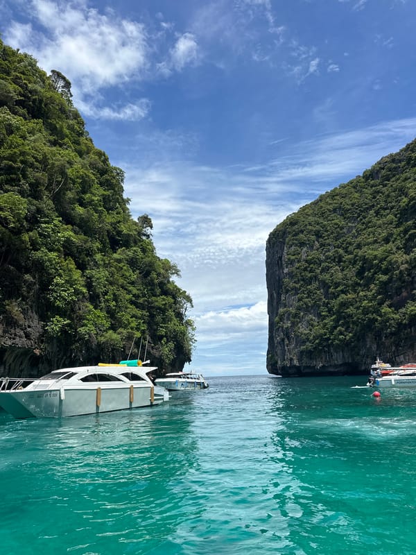 Ao Nang bay life: boats, karsts, and shoreside crowds