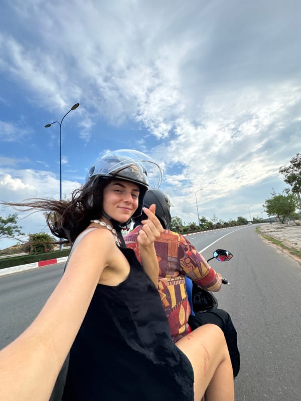 Scooter passengers capture selfie on Mui Ne road