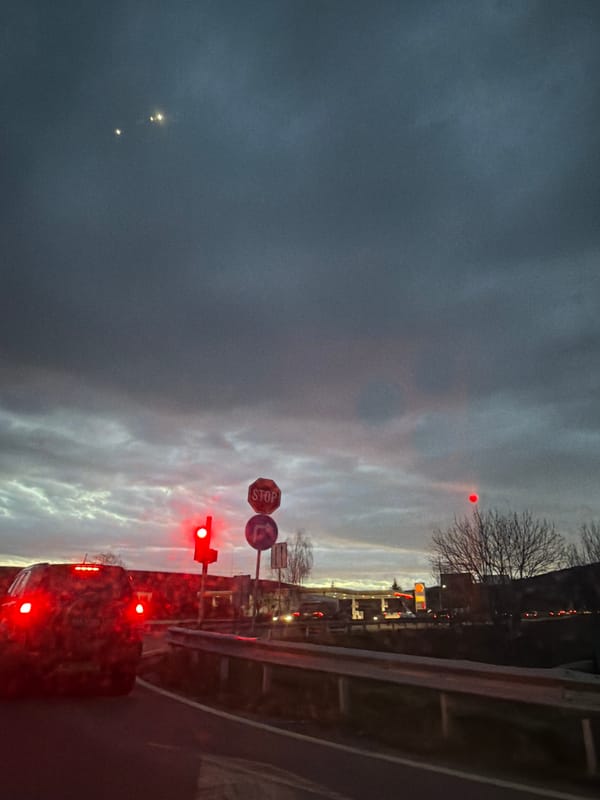 Early morning traffic navigates red light in Dragichevo