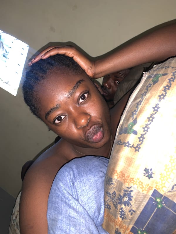 Two people captured in quiet morning moment in Nigeria