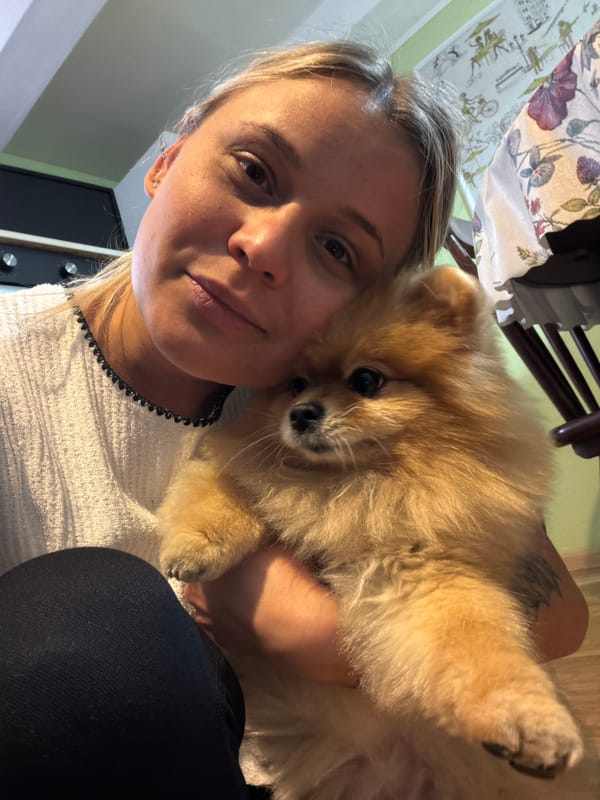 Woman takes selfies with cat in Sarapul apartment