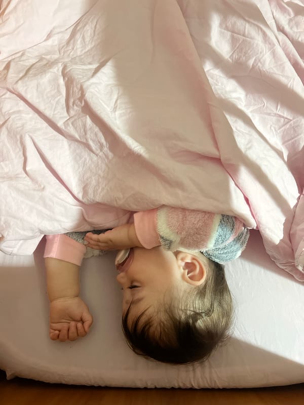 Baby sleeps peacefully in crib in Elena, Bulgaria