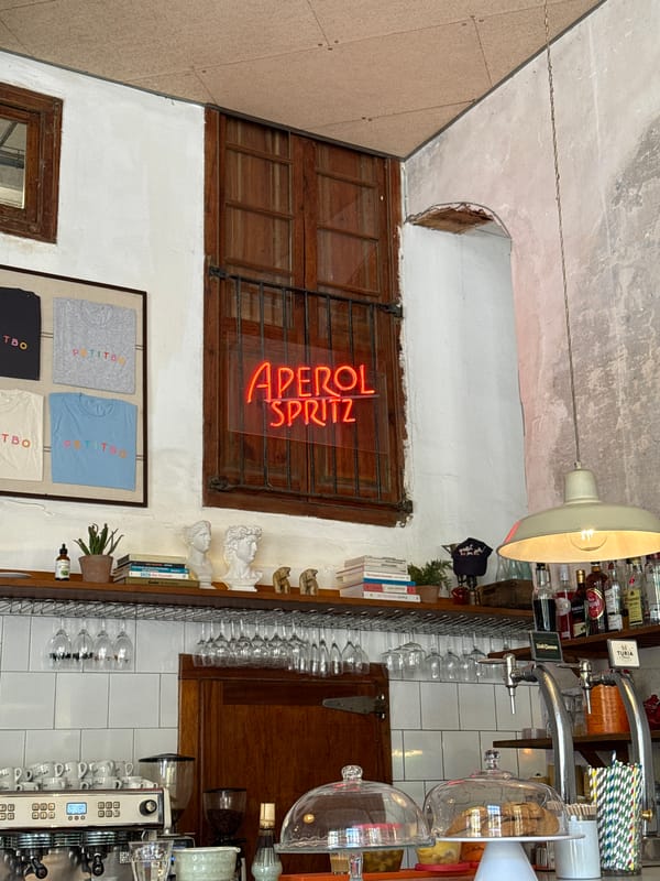 Barcelona cafe interior captured with Aperol Spritz neon signage